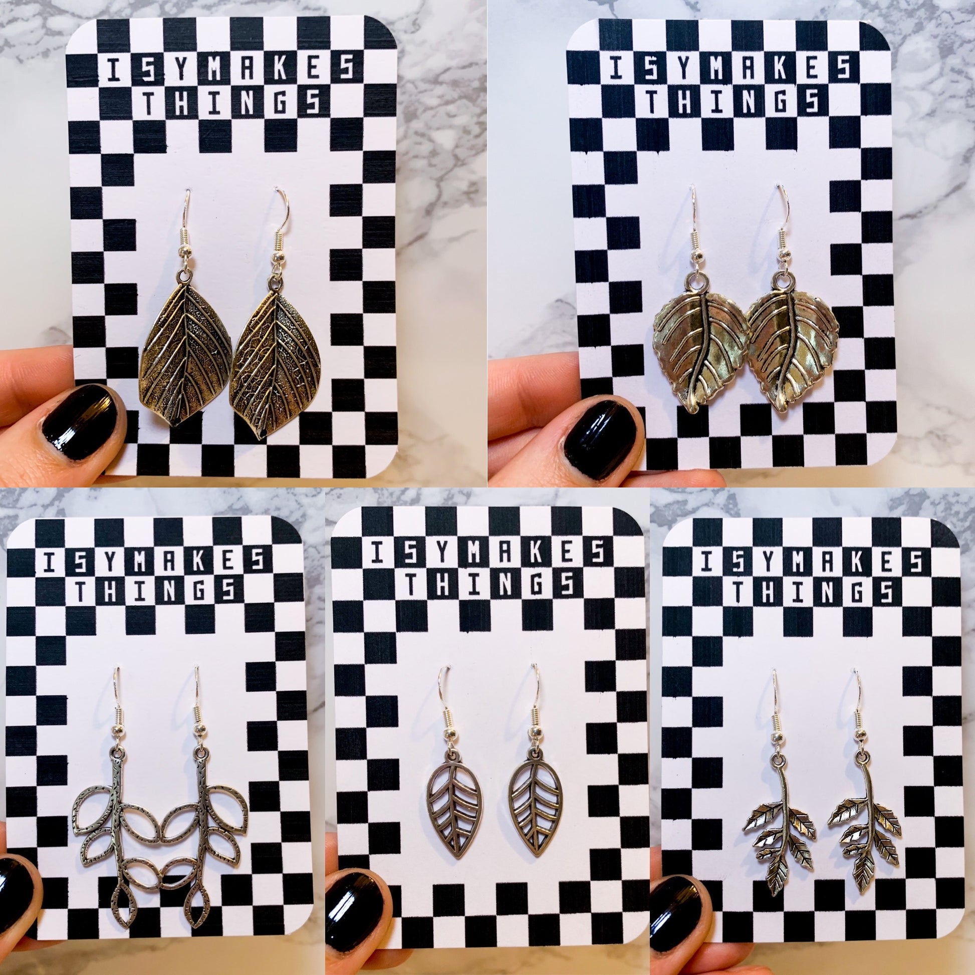 Silver leaf dangle earrings on a black and white checkered backing card with the title isymakesthings