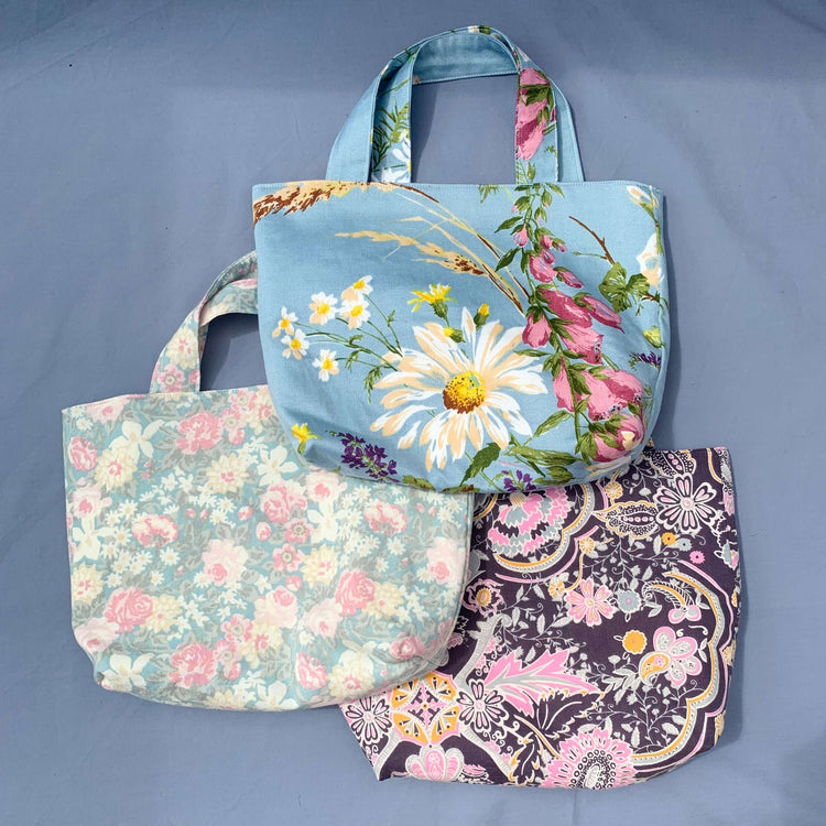 Three floral tote bags