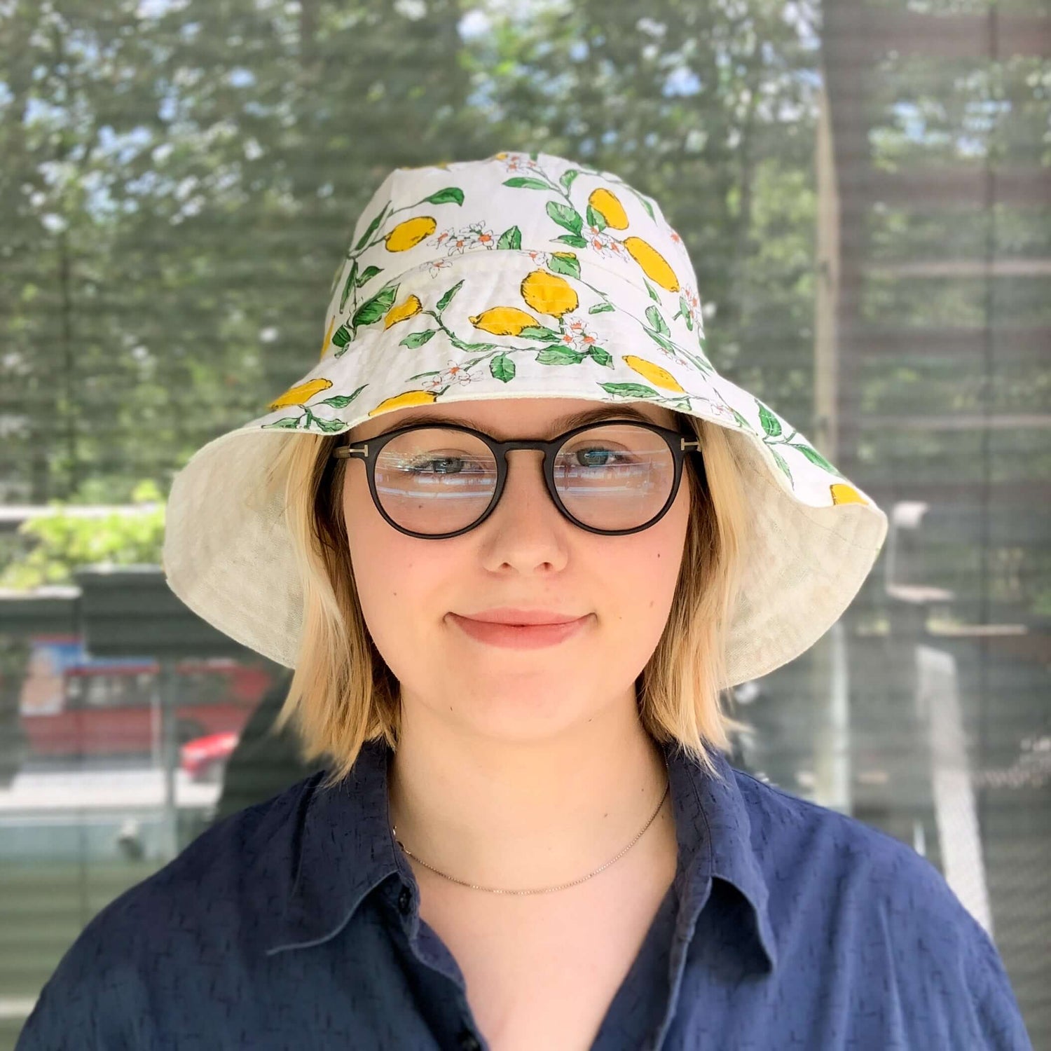 A lemon print white bucket style sun hat