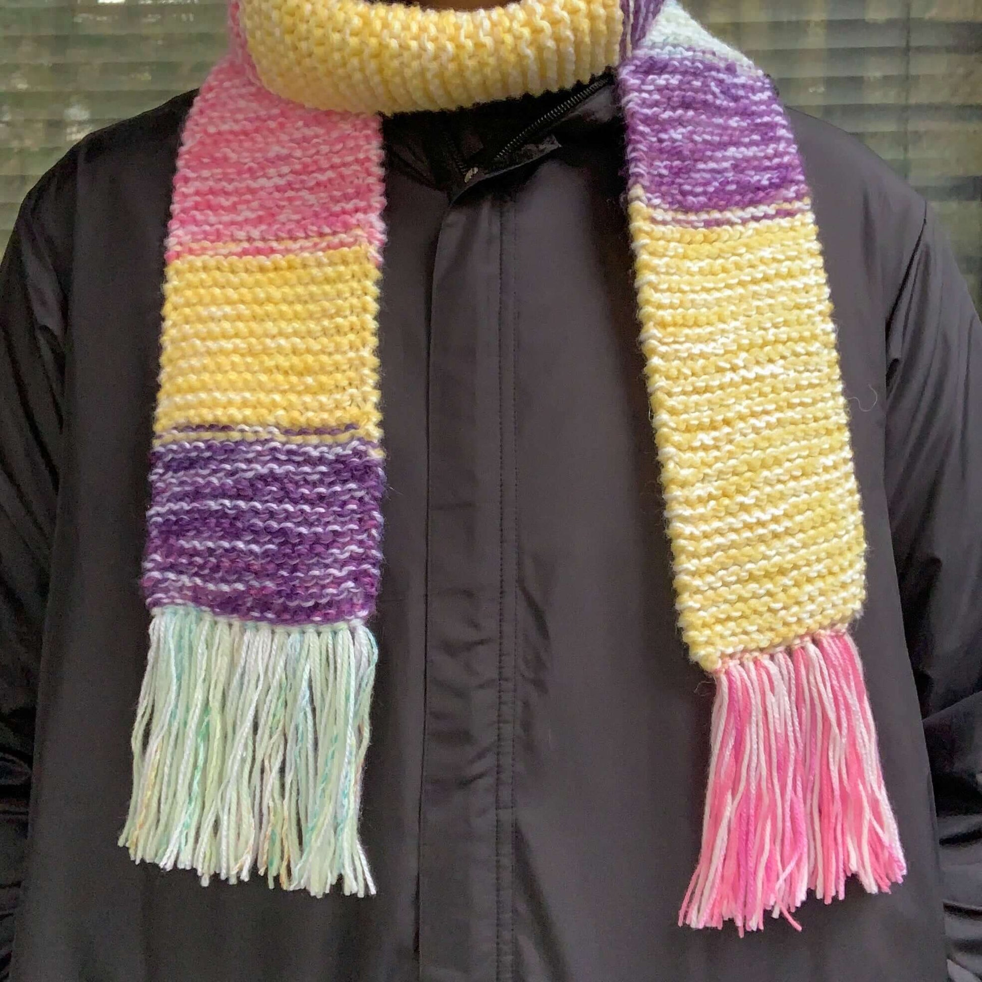 green purple yellow and pink colour block knitted tasseled scarf