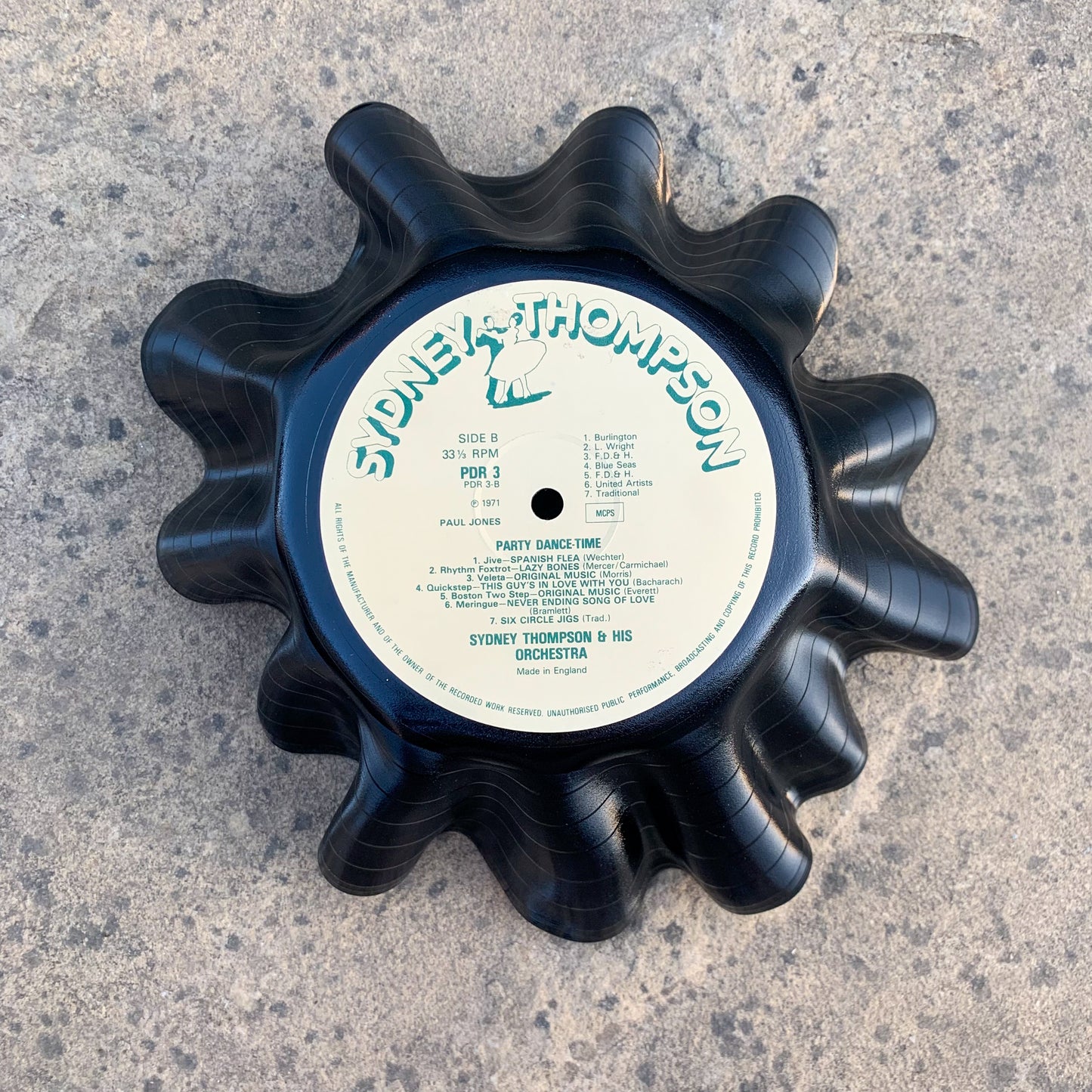 A wavy vinyl record bowl upside down